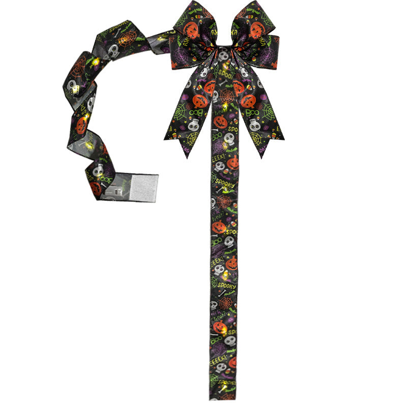 LED illuminated Halloween bow for cabinets